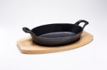 CAST IRON MINI SKILLET. OVAL TRIVET. RESTAURANT SERVING DISHES.